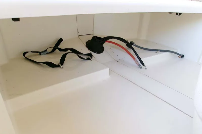 Slide: The Image of Interior view of 2025 Mako Pro Skiff 13 CC boat storage compartment. - 5
