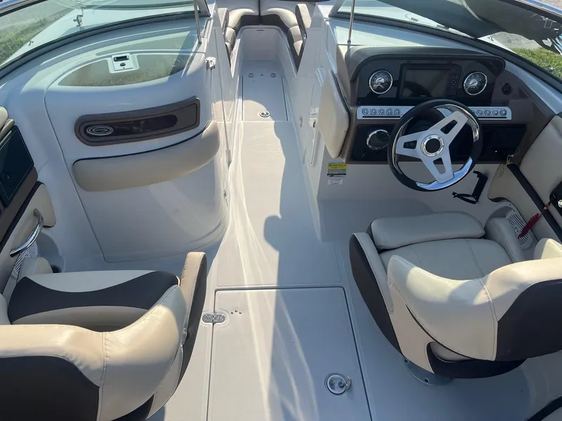 Slide: The Image of 2022 Crownline 260 XSS boat interior with modern dashboard and comfortable seating. - 7