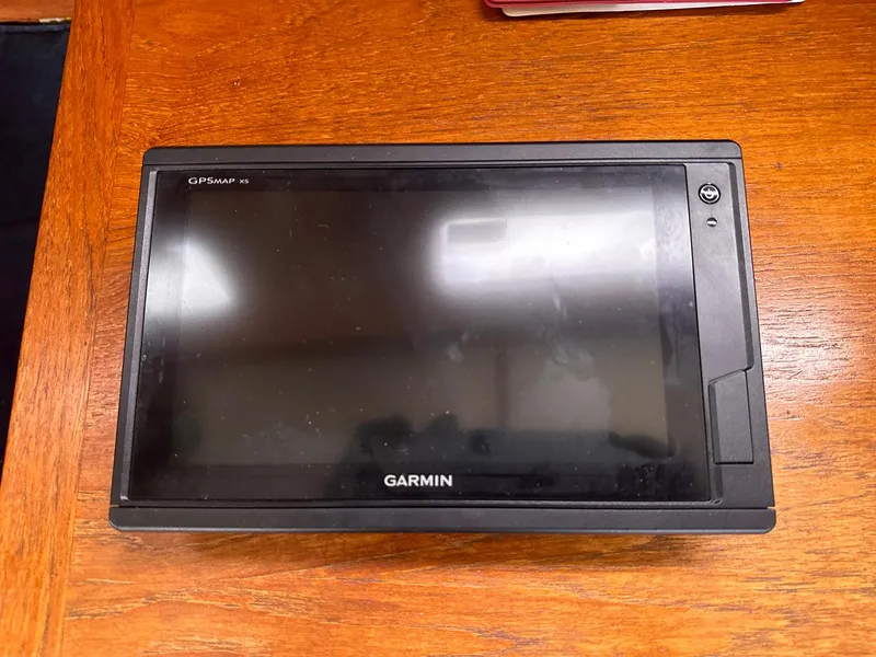 Slide: The Image of Garmin GPS device on wooden surface, Whiting 40, 1985 model. - 18