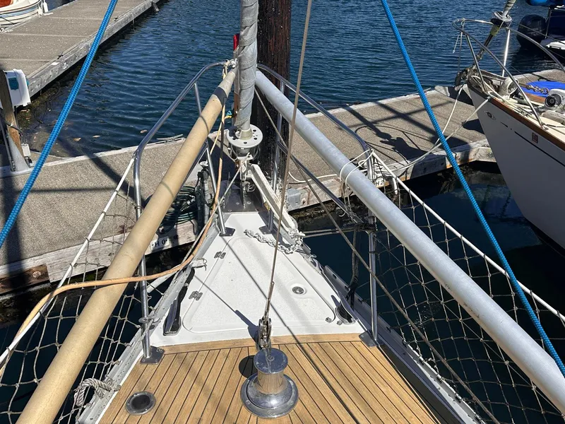 Slide: The Image of Bow of a 1985 Whiting 40 sailboat docked at a marina. - 2