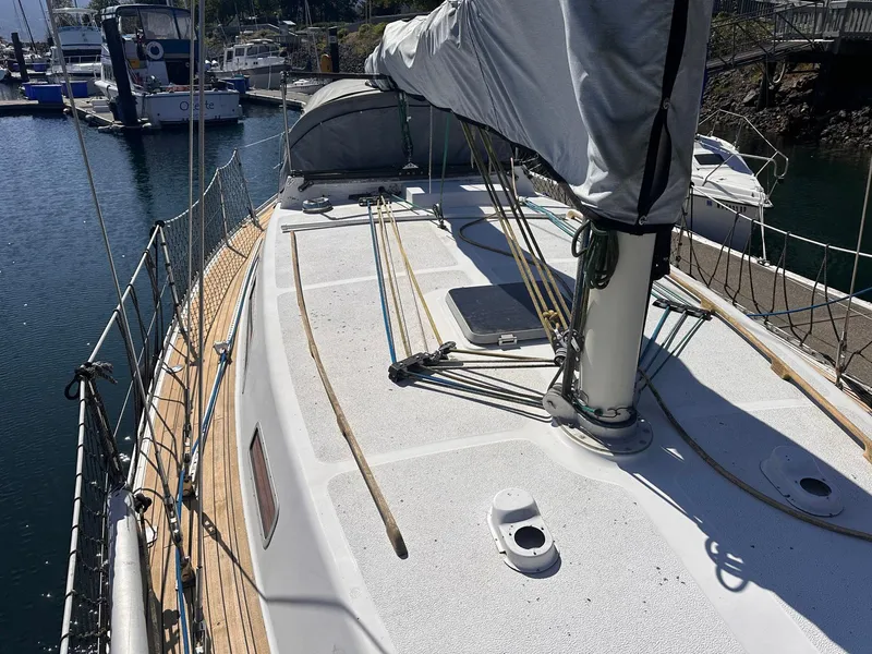 Slide: The Image of Sailboat deck of 1985 Whiting 40, docked in marina, sunny day. - 4
