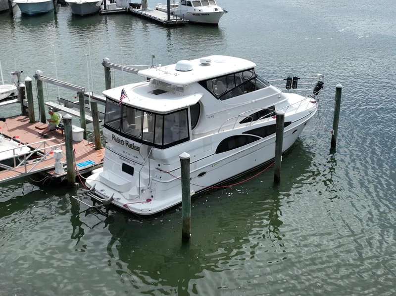 Slide: The Image of 2006 Carver 466 Motor Yacht docked at marina, viewed from above. - 2