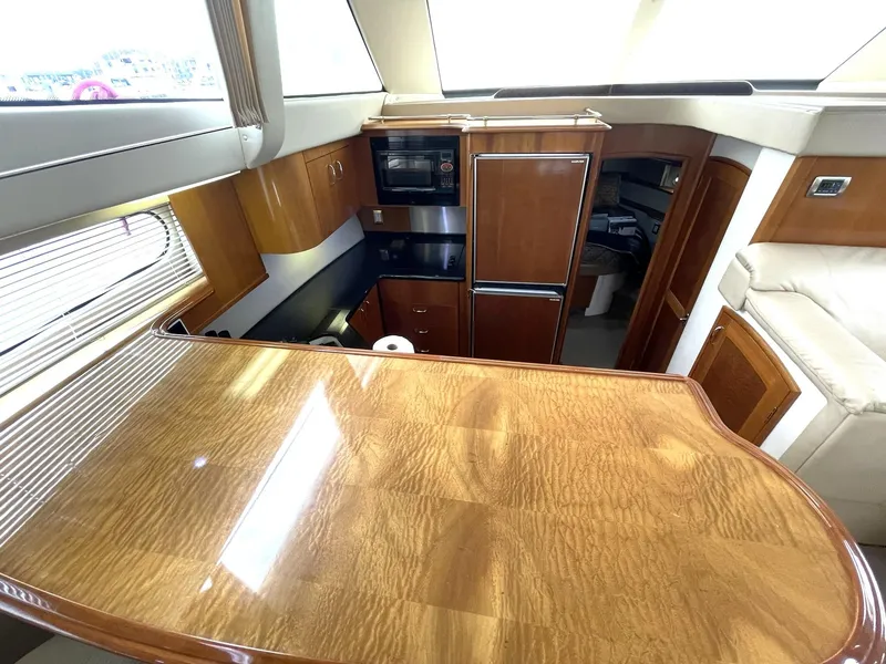 Slide: The Image of Luxurious interior of 2006 Carver 466 Motor Yacht with wood finish and modern amenities. - 20