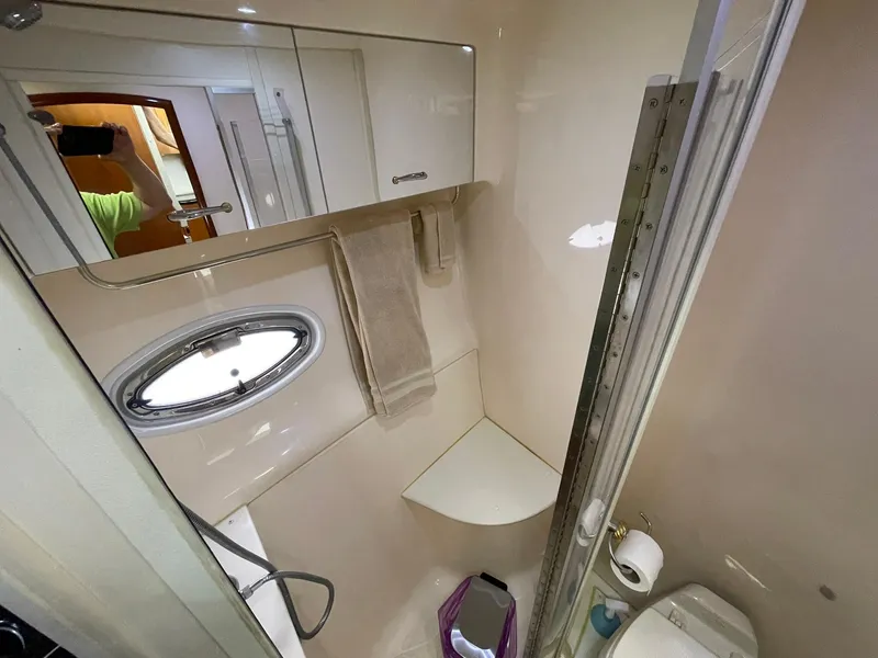 Slide: The Image of Bathroom interior of 2006 Carver 466 Motor Yacht with shower and porthole window. - 54