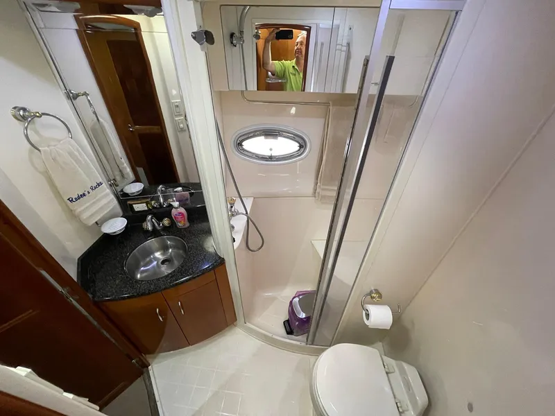 Slide: The Image of Bathroom interior of 2006 Carver 466 Motor Yacht with shower, sink, and toilet. - 55