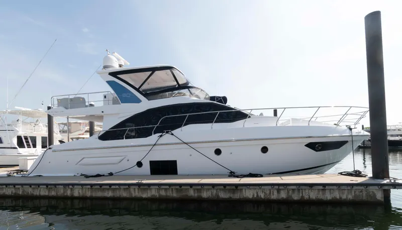 The Image of 2022 Azimut Fly 50 yacht docked at marina, side view. - 0