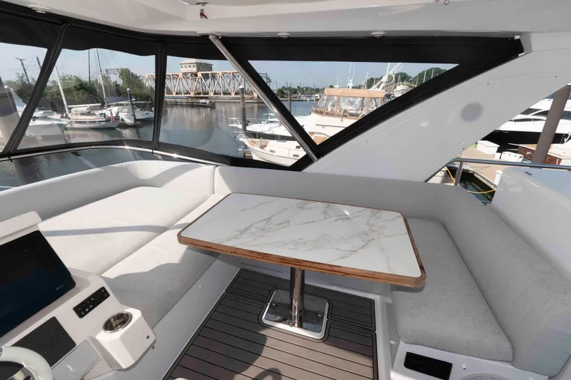 Slide: The Image of Luxurious interior of 2022 Azimut Fly 50 yacht with marble table and waterfront view. - 15