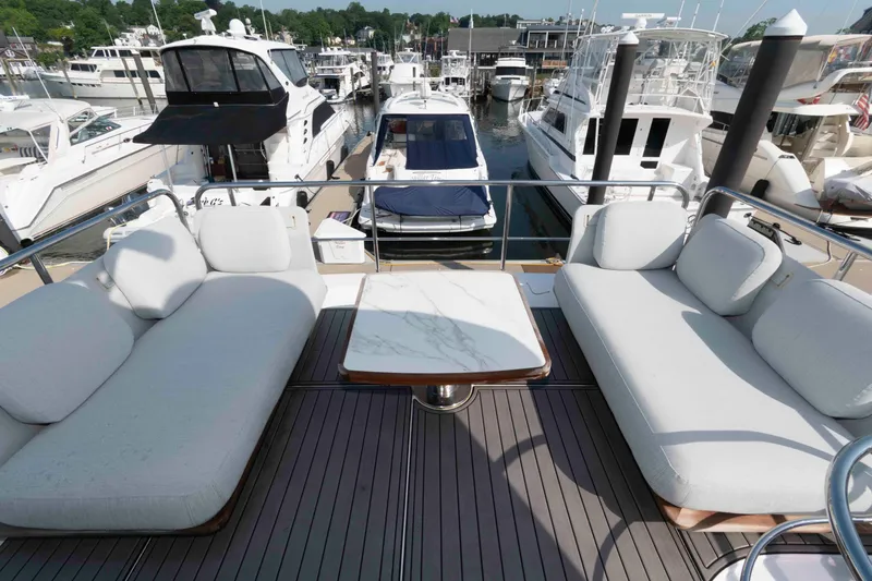 Slide: The Image of Luxurious seating area on 2022 Azimut Fly 50 yacht, docked at a marina. - 16