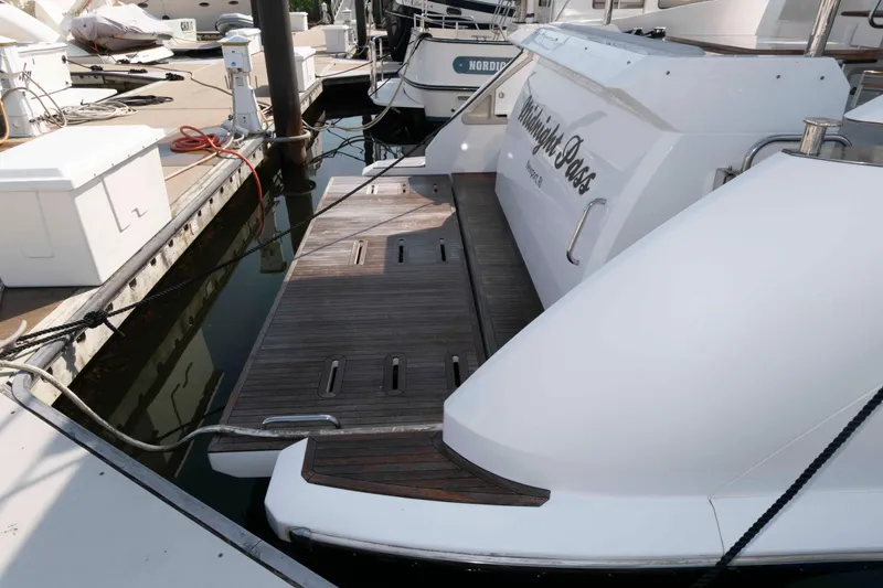 Slide: The Image of Azimut Fly 50 yacht, 2022 model, docked with wooden swim platform. - 21