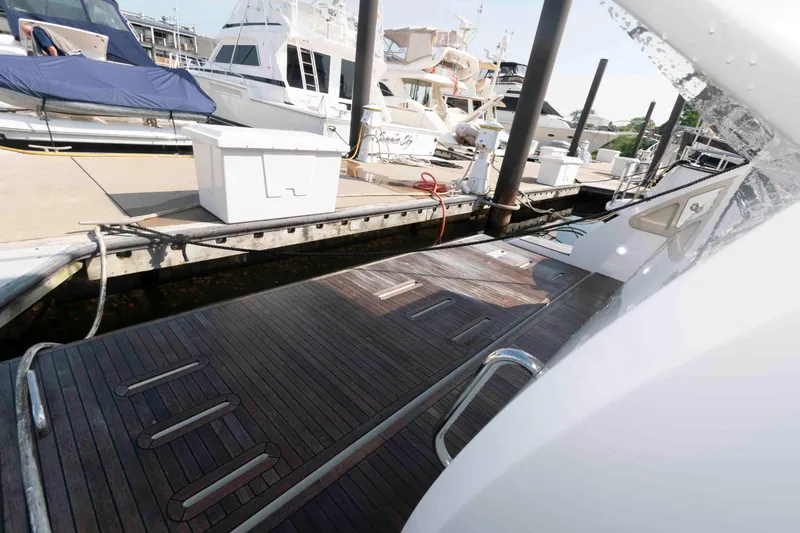 Slide: The Image of Azimut Fly 50 yacht docked at marina, showcasing sleek design and modern features. - 22