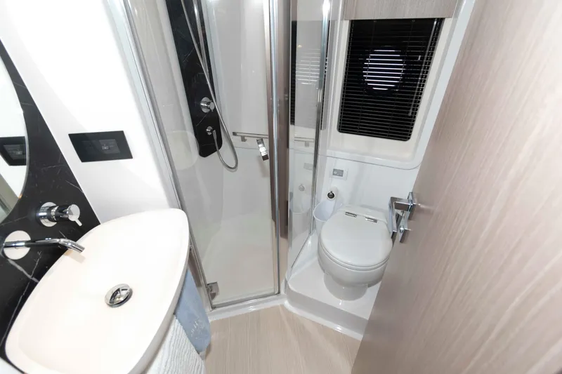 Slide: The Image of Luxurious bathroom in 2022 Azimut Fly 50 yacht, featuring modern fixtures and elegant design. - 39
