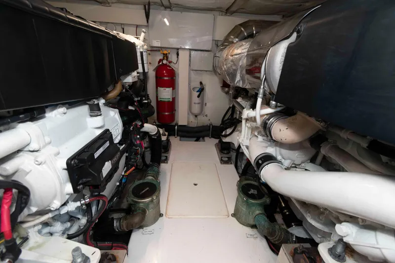 Slide: The Image of Engine room of 2022 Azimut Fly 50 yacht, featuring dual engines and fire extinguisher. - 43