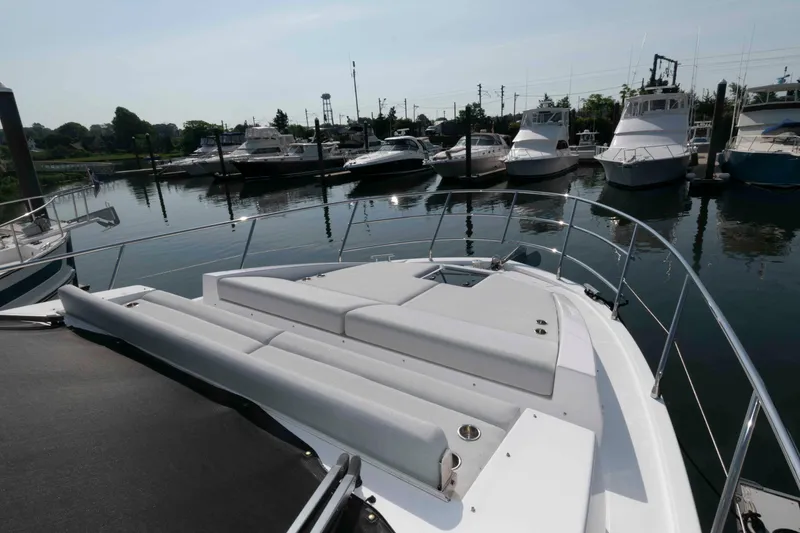Slide: The Image of Azimut Fly 50 yacht, 2022 model, docked in a marina with other boats. - 6