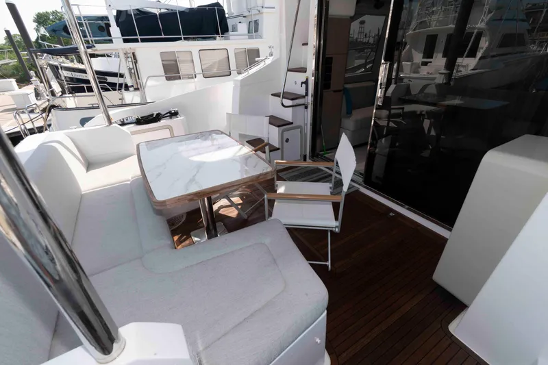 Slide: The Image of Azimut Fly 50 yacht 2022, featuring elegant outdoor seating and dining area. - 7