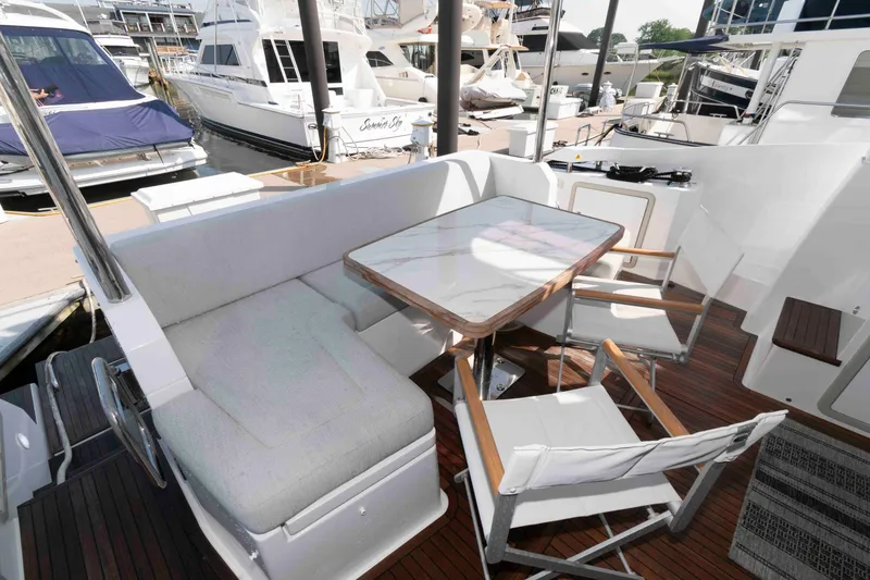Slide: The Image of Luxurious seating area on 2022 Azimut Fly 50 yacht with elegant table and chairs. - 8