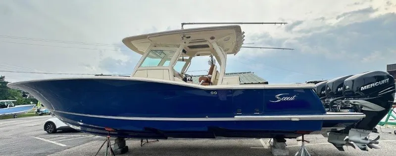 The Image of 2018 Scout 350 LXF boat with blue hull and twin Mercury engines. - 0