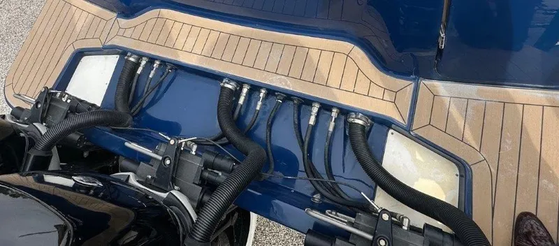 Slide: The Image of 2018 Scout 350 LXF boat with detailed view of engine connections and deck design. - 31