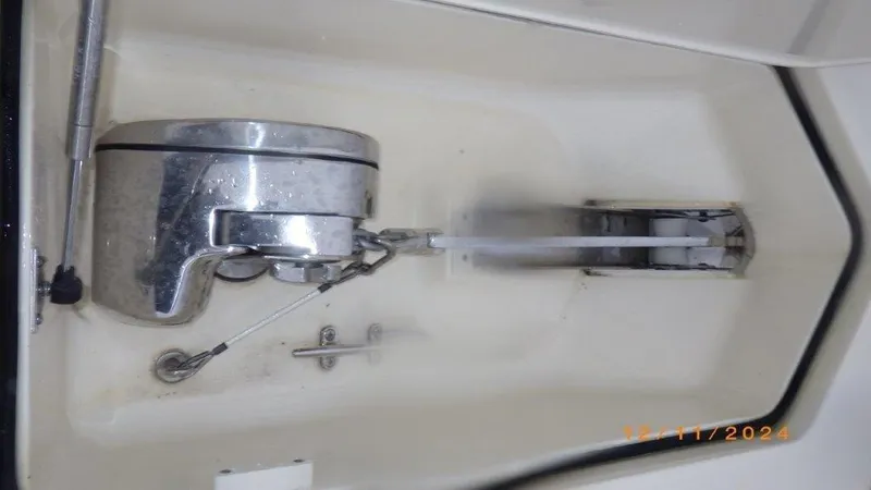 Slide: The Image of Anchor compartment of 2018 Scout 350 LXF boat, featuring stainless steel hardware. - 36
