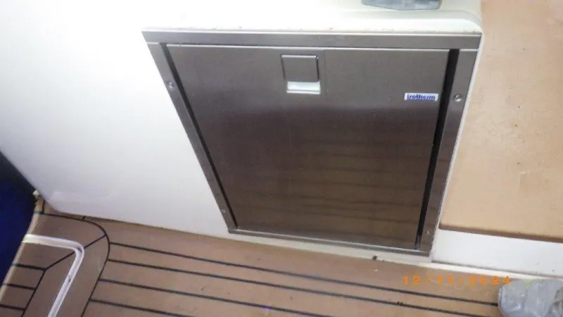 Slide: The Image of Stainless steel compartment on 2018 Scout 350 LXF boat interior. - 37