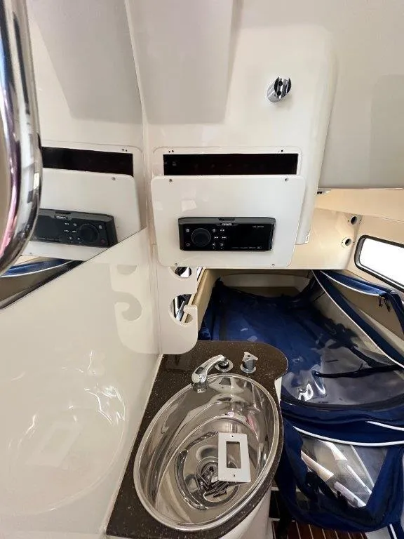 Slide: The Image of 2018 Scout 350 LXF cabin interior with sink and storage area. - 6