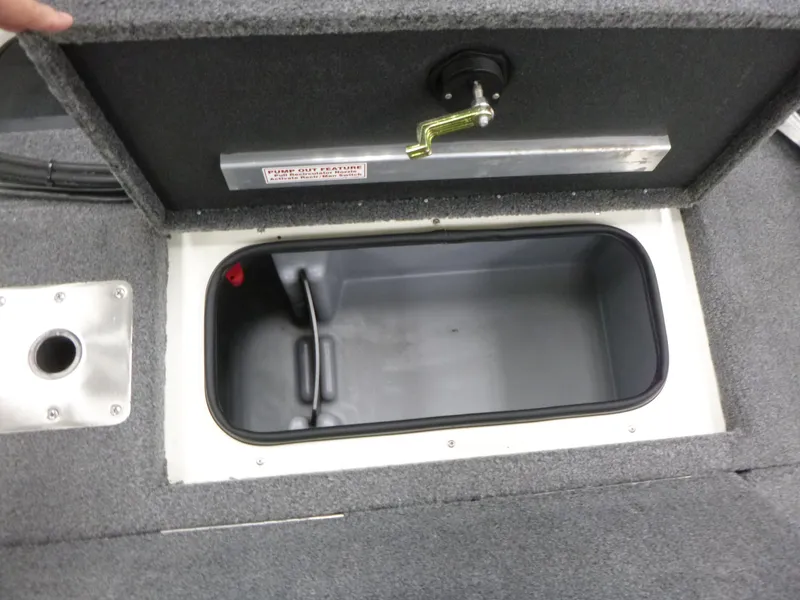 Slide: The Image of 2024 Ranger VS1782SC Angler boat storage compartment with open lid and handle. - 7