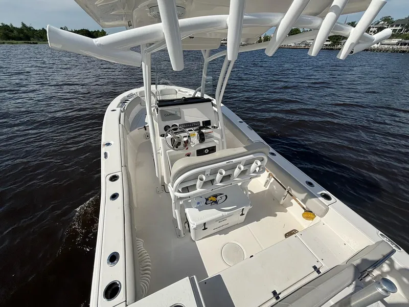 Slide: The Image of 2020 Sea Fox 228 Commander boat on water, featuring spacious deck and modern controls. - 12