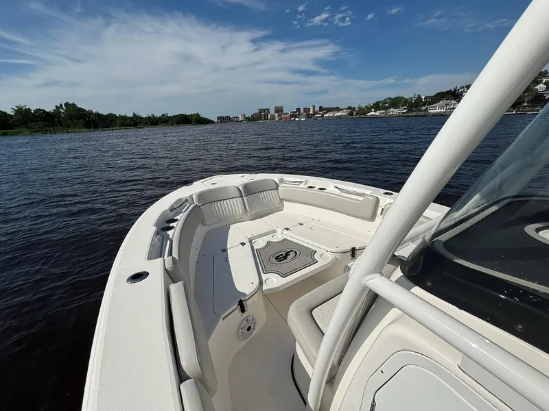 Slide: The Image of 2020 Sea Fox 228 Commander boat on a calm river with city skyline. - 6
