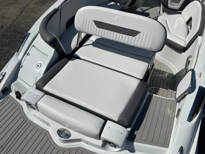 Slide: The Image of 2026 Crownline 298 SS boat interior with sleek, modern seating and gray upholstery. - 18