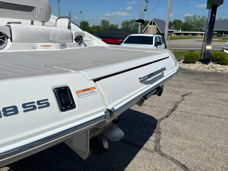 Slide: The Image of 2026 Crownline 298 SS boat rear view, showcasing sleek design and spacious deck. - 20