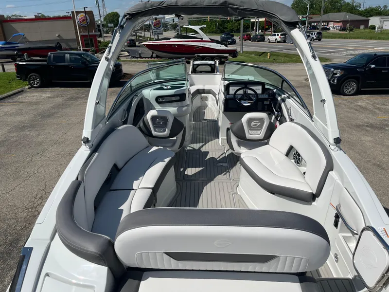 Slide: The Image of 2026 Crownline 298 SS boat interior with sleek seating and modern dashboard. - 25