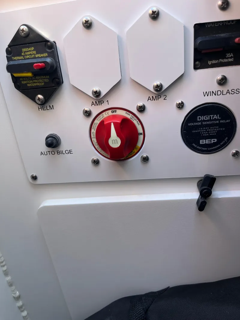 Slide: The Image of Control panel of 2026 Crownline 298 SS boat with switches and digital display. - 3