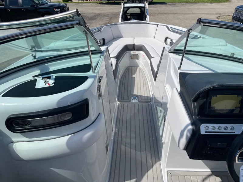 Slide: The Image of 2026 Crownline 298 SS boat interior with sleek design and modern dashboard. - 8