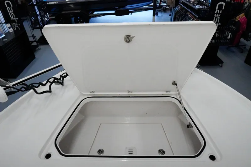 Slide: The Image of Open storage compartment on 2020 Caymas 26 HB boat, showcasing interior space. - 10