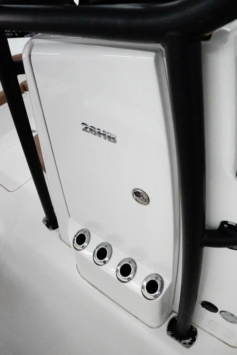 Slide: The Image of 2020 Caymas 26 HB boat console with rod holders and sleek design. - 14