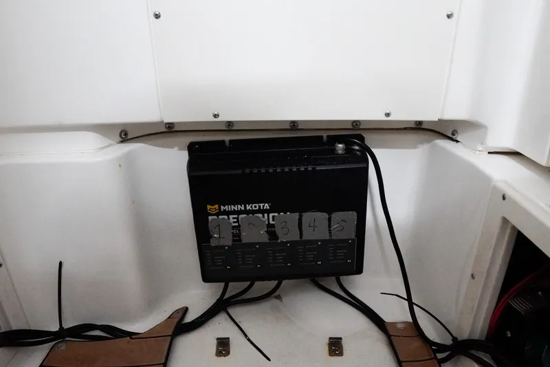 Slide: The Image of Minn Kota Precision charger in 2020 Caymas 26 HB boat compartment. - 16