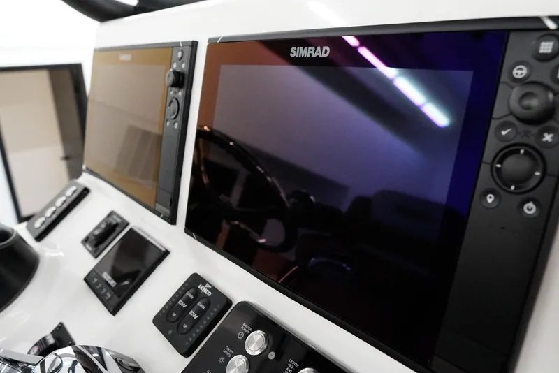 Slide: The Image of Control panel of 2020 Caymas 26 HB boat with Simrad displays. - 20