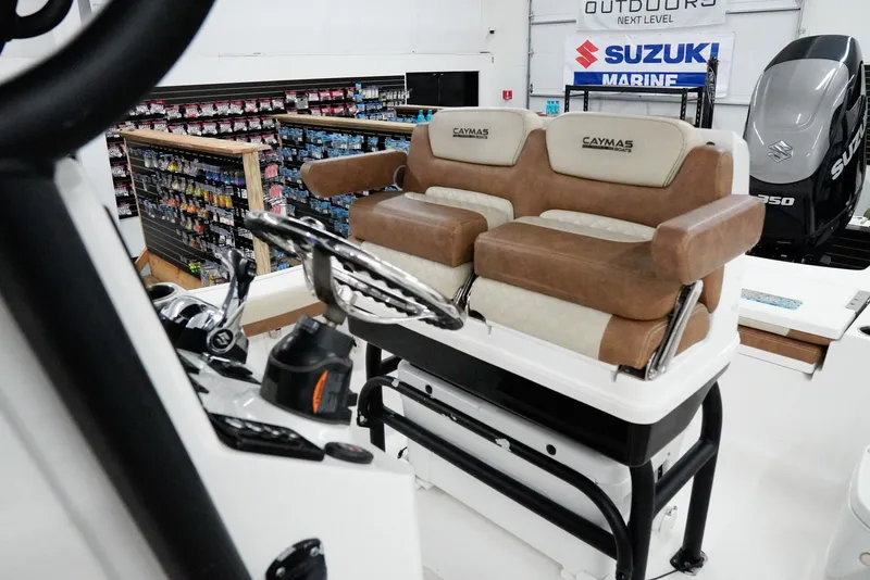 Slide: The Image of 2020 Caymas 26 HB boat interior with dual seats and Suzuki Marine engine. - 22