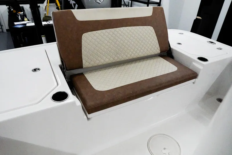 Slide: The Image of 2020 Caymas 26 HB boat seat with brown and cream upholstery, featuring diamond stitching. - 23