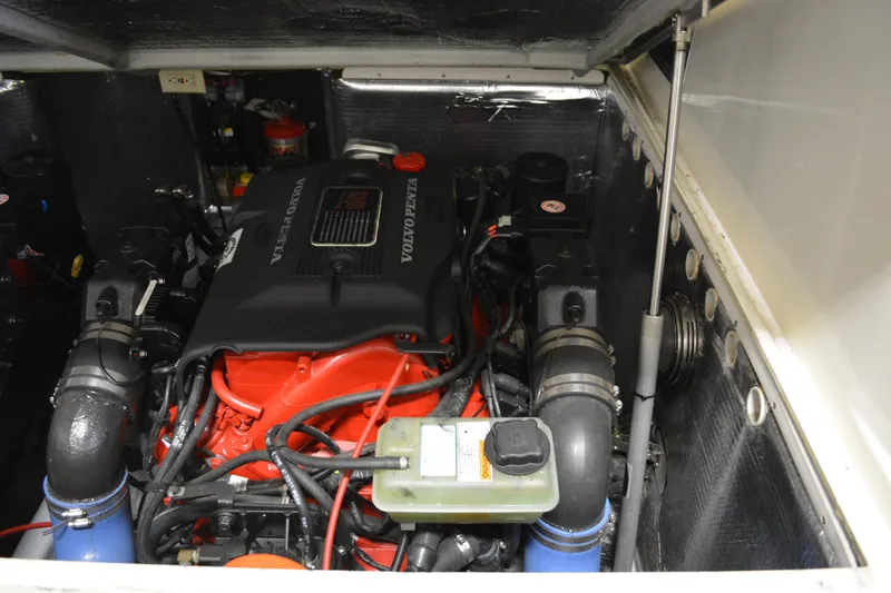 Slide: The Image of Engine compartment of a 2004 Carolina Classic 28 boat, featuring a Volvo Penta engine. - 13