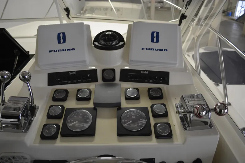 Slide: The Image of Control panel of a 2004 Carolina Classic 28 boat with Furuno navigation equipment. - 22