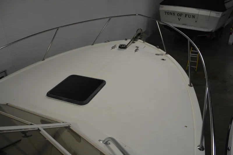 Slide: The Image of 2004 Carolina Classic 28 boat deck with railing and hatch in storage. - 4