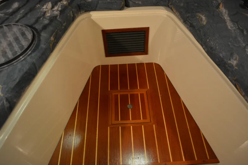 Slide: The Image of 2004 Carolina Classic 28 interior with wooden flooring and vented panel. - 43