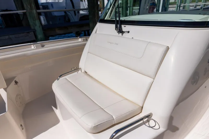 Slide: The Image of 2022 Grady-White Canyon 336 boat with white cushioned seating. - 21