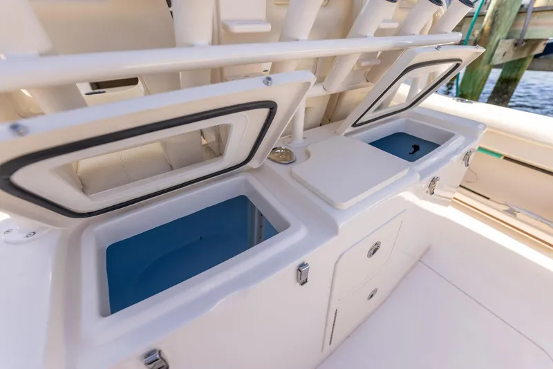 Slide: The Image of 2022 Grady-White Canyon 336 boat with open storage compartments. - 25