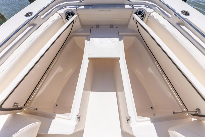 Slide: The Image of 2022 Grady-White Canyon 336 boat interior with open storage compartments. - 30