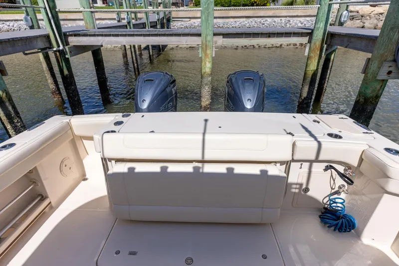 Slide: The Image of 2022 Grady-White Canyon 336 boat with dual outboard engines at dock. - 35