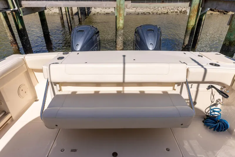 Slide: The Image of 2022 Grady-White Canyon 336 boat with dual engines and seating at dock. - 36