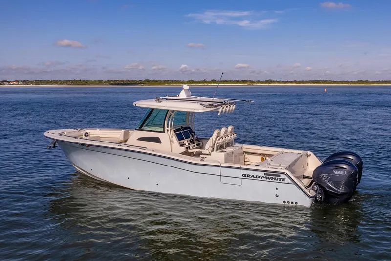 Slide: The Image of 2022 Grady-White Canyon 336 boat on calm water, side view. - 9