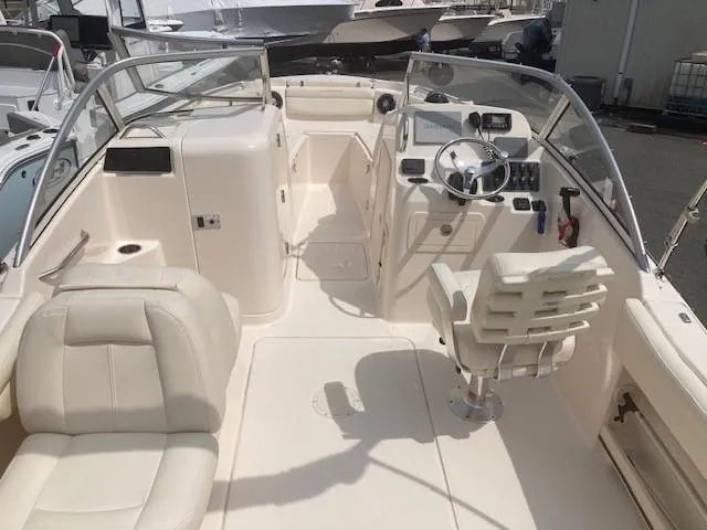 Slide: The Image of 2022 Grady-White Freedom 215 boat interior with seating and steering console. - 3