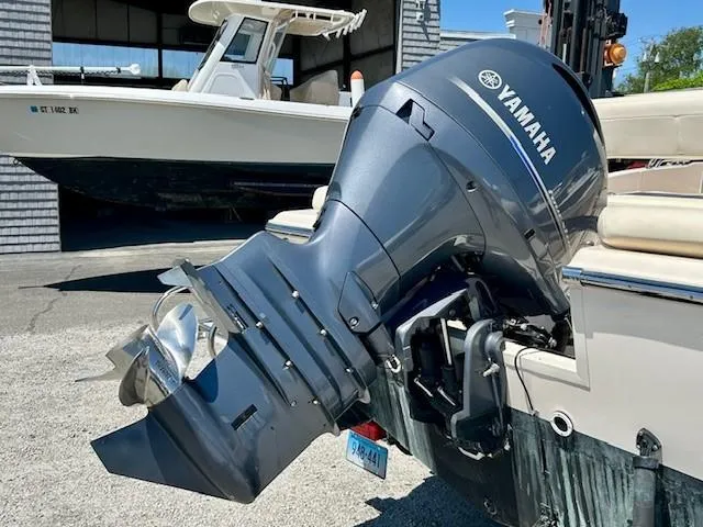 Slide: The Image of 2020 Grady-White Fisherman 180 with Yamaha outboard motor, docked outdoors. - 16
